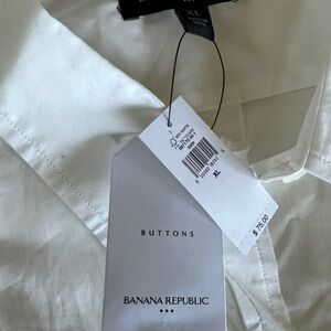 NWT Beautiful white oversized white button up blouse.